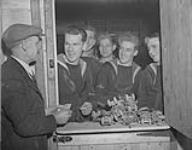 Canadian seamen renting roller-skates at a roller-skating rink Jan. 1945