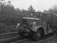 3rd CANADIAN INFANTRY DIVISION IN HOLLAND. Ammunition truck on muddy road 8 Feb. 1945