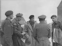 Lt. R.D. McQuillan, Major General R.H. Keefler, Brigadier J.A. Roberts, Captain R. Pootmans and German Adjutant of the barracks visiting the Jerry's barracks 2-5 May 1945