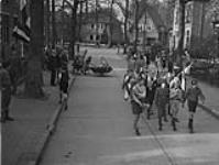Parade of children after the liberation of the city by the 1 Cdn Division 17 Apr. 1945