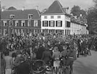 Pipe band of the 48th Highlanders of Canada playing the Retreat before Queen Wilhelmina's Palace 20 Apr. 1945