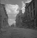 Patrols moves through streets after attack 16 - 17 Aug. 1944