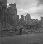 Bulldozer ploughing rubble from church ruin 16/17 Aug. 1944
