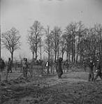 "By noon, over 500 prisoners had been taken. Here some are being herded into a corral." 24 Mar. 1945