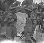 Lieutenant-Colonel R.A. Lindsay with Lieutenant Colin McDougal, of Princess Patricia's Canadian Light Infantry, who has just been made adjutant of the regiment 23-28 July 1943