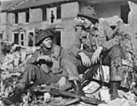 Captains Albert Johnson and Gordon, both of the 1st Battalion, The Canadian Scottish Regiment, taking part in a house-clearing training exercise, England, 22 April 1944 April 22, 1944.