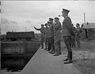 Canadians in France. Russian Mission from Moscow looking over docks 28-Jul-44