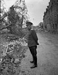 Major General Vaseliev, member of the Russian mission from Moscow, viewing wreckage 28-Jul-44