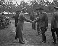 Lieutenant General Crocker shaking hands with Colonel Gorbatov, member of the Russian mission from Moscow 28-Jul-44