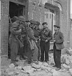 Canadian infantry talk with French civilians 10-Jul-44
