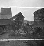Pioneers of the 122nd Field Company, Royal Engineers, repairing roads 08-Jul-44