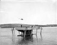 Royal Canadian Navy yacht PICKLE: launching after repairs at H.M.C.S. Shearwater 27 May 1955
