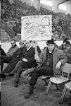 Striking teachers protesting Bill 25 with poster displaying cartoon figures of Maurice Duplessis and Daniel Johnson 13 Feb 1967