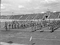 Brass/reed and pipe bands of the Canadian Womens' Army Corps at a Canadian sports meet 11 Aug 1945