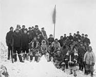 Large group of Inuit with crewmen of C.G.S. ARCTIC at ceremonial taking of possession by Capt. Joseph-Elzéar Bernier, Baffin Island, N.W.T., [Nunavut], 9 November 1906 November 9, 1906.