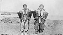 Canadian Arctic Expedition -1916: Two Copper Inuit girls dressed in caribou clothing, Bernard Harbour, N.W.T. [Nunavut], 11 July 1916 July 11, 1916.