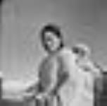 Mrs. Annie Akpalialuk with a child [Annie Akpalialuk and her oldest child Davidee Akpalialuk in an "amauti".] Août 1946