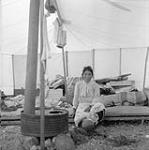 Woman sitting in tent 1948