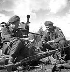 Lance-Bombardier R.G. Laidman and Gunner D. Rodgers of the 3rd Light Anti-Aircraft Regiment, Royal Canadian Artillery (R.C.A.), playing cribbage near Antwerp, Belgium, 30 September 1944 September 30, 1944.