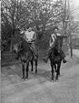 Private H. Lotz and Corporal H.L. Anderson of the 1st Canadian Parachute Battalion on horseback, Brelingen, Germany, 12 April 1945 April 12, 1945.