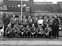 Members of the Canadian Military Headquarters (CMHQ) team which represented Canada in a Canada - United States baseball game at Wembley Stadium, London, England, 3 June 1944 June 3, 1944.