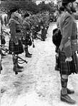 Soldiers of the Seaforth Highlanders of Canada and the Lorne Scots taking part in the Changing of the 1st Canadian Corps Guard ceremony, Rocca, Italy, 1 March 1944 Marh 1, 1944