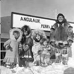 Angulalik and his family at Perry River (Kuugjuaq), Nunavut. [Left to right: Mary Posoktok, Margaret Kuptana, Mabel Ekvana holding baby Lena Tuiligakyok] 1950.