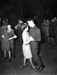 Gunner P.C. Bronson of the Royal Canadian Artillery dancing in the ballroom during a 72-hour leave at No.4 Rest Camp c January, 1946