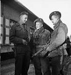 Lieutenant-Colonel D.G. Maclaughlin of the Calgary Highlanders speaks with scouts Corporal S. Kormendy and Sergeant H.A. Marshall, Kapellen, Belgium, 6 October 1944 06-Oct-44