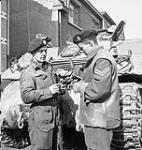 Trooper J. McCallum and Corporal G.P. Patten of the Fort Garry Horse working on their armoured recovery vehicle, Putte, Netherlands, 6 October 1944 06-Oct-44