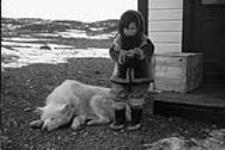 Inuit child and dog 1945