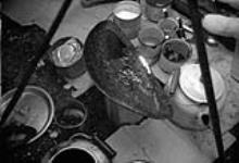 Interior of summer tent showing seal oil lamp 23 July 1946.