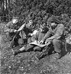 Infantrymen of the Calgary Highlanders buying 8th Victory Loan bonds while resting in the Reichswald, Germany, 21 March 1945 March 21, 1945