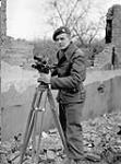 Sergeant L.G. Clarke, a cameraman with the Canadian Army Film and Photo Unit, south of Nijmegen, Netherlands, 10 February 1945 February 10, 1945