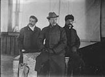 Signor Marconi and others sitting outside ca. 1901-1930