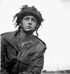 An unidentified paratrooper of the 1st Canadian Parachute Battalion at a transit camp near Down Ampney, England, June 1944 [ca. June 1944].
