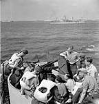 Personnel of a Canadian Highland regiment receiving training about the Oerlikon 20mm. gun aboard the troopship H.M.T. NEA HELLAS en route to Philippeville, Algeria, 5 July 1943 July 5, 1943.