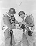 Parachute candidates preparing to jump from a jump tower at A35 Canadian Parachute Training Centre, Camp Shilo, Manitoba, Canada, 15 February 1944 February 15, 1944