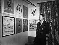 Captain E.R. Mainguy, Captain (D), Royal Canadian Navy (R.C.N.), in The Crowsnest, a club which he established for seagoing officers, St. John's, Newfoundland, September 1942 September, 1942.