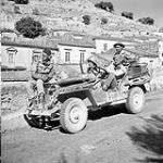 Canadian war correspondents in a jeep, Modica, Italy, 13 July 1943 July 13, 1943.