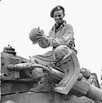 Trooper J.W.McConnell, Three Rivers Regiment, examining a knocked-out German PzKpfW III tank, San Leonardo di Ortona, Italy, 20 December 1943 December 20, 1943.