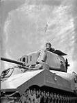 Unidentified crew commander in a Ram tank at A33 Canadian Armoured Corps Training Establishment, Camp Borden, Ontario, Canada, 7 July 1943 July 7, 1943.