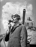 Unidentified radio operator and crew commander with a Ram tank at A33 Canadian Armoured Corps Training Establishment, Camp Borden, Ontario, Canada, 7 July 1943 July 7, 1943.