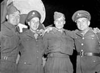 Two unidentified Canadian members of The First Special Service Force with two unidentified Canadian soldiers at the Legion Fair, Ottawa, Ontario, Canada, 11 September 1943 September 11, 1943.