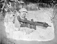 An unidentified parachute-qualified soldier, who is armed with a PIAT anti-tank weapon, undertaking winter infantry training at A-35 Canadian Parachute Training Centre (Canadian Army Training Centres and Schools), Camp Shilo, Manitoba, Canada, 20 March 1945 March 20, 1945.
