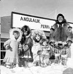 Angulalik and his family at Perry River (Kuugjuaq), Nunavut [Left to right: Mary Posoktok, Margaret Kuptana, Mabel Ekvana holding baby Lena Tuiligakyok] 1950.