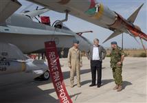 [Prime Minister Stephen Harper tours the Trapani-Birgi Air Force Base with Lieutenant-General Charles Bouchard, Task Force Libeccio Chief Warrant Officer and Lieutenant Colonel Daniel McLeod in Trapani, Italy] 1 September 2011