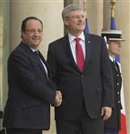 [Prime Minister Stephen Harper is greeted by French President François Hollande at the Palais de l'Élysée in Paris, France] 14 June 2013