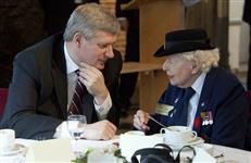 [Prime Minister Stephen Harper chats with Elsie Dandy, a nurse during World War II, during a veterans luncheon in their honour in Bergen op Zoom in the Netherlands] 6 May 2010