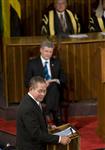 [Prime Minister Stephen Harper listens as Prime Minister Bruce Golding of Jamaica addresses a joint session of Jamaica's Houses of Parliament in Kingston, Jamaica] 20 April 2009